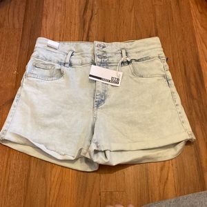 Light blue shorts with 3 buttons